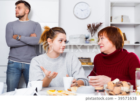 Mother comforting daughter after discord with husband Mother comforting daughter after discord with husband 39571638