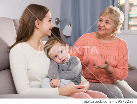 Aged woman is sharing her experience with daughter for upbringing toddler Aged woman is sharing her experience with daughter for upbringing toddler 39572282