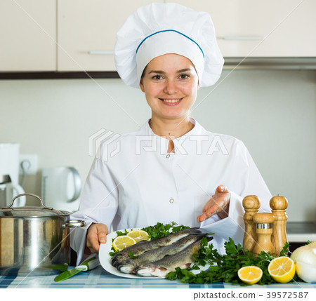 Professional chef cooking fresh trout at kitchen Professional chef cooking fresh trout at kitchen 39572587