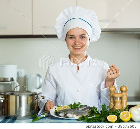 Professional chef cooking fresh trout at kitchen Professional chef cooking fresh trout at kitchen 39572605