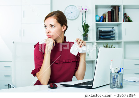 Depressed woman in office 39572884