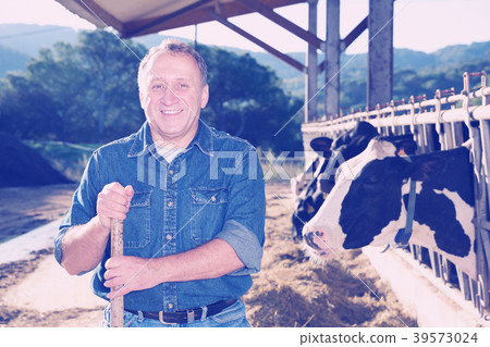 Portrait of glad male standing at her workplace 39573024