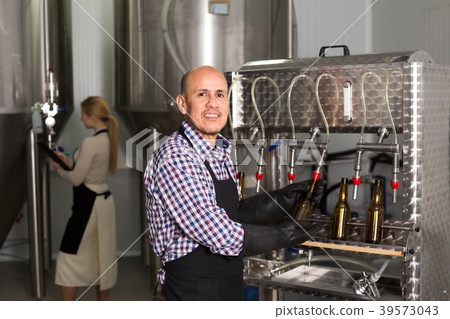 Male worker on beer brewery. 39573043