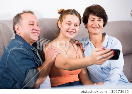 Happy family is taking selfie on the phone 39573625
