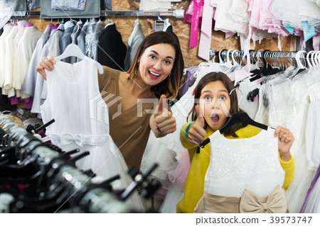 Family enjoying purchases in shop 39573747