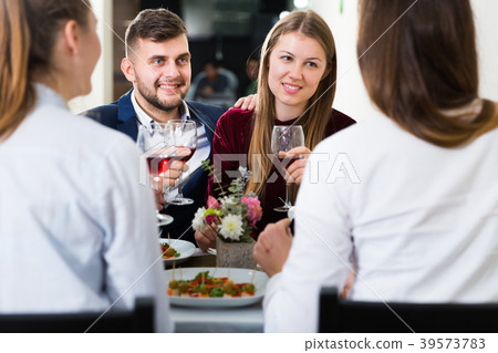 Friends are having dinner in the restaurante Friends are having dinner in the restaurante 39573783