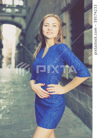 Elegant girl is posing in blue dress Elegant girl is posing in blue dress 39574233