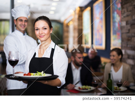 Waitress with chef in restaurant Waitress with chef in restaurant 39574241