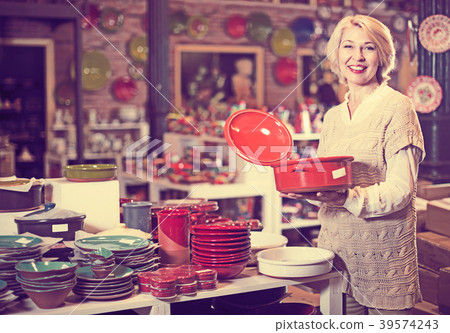 Woman buying ceramic tableware Woman buying ceramic tableware 39574243