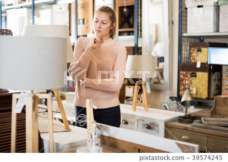 Female purchaser buying torchere Female purchaser buying torchere 39574245