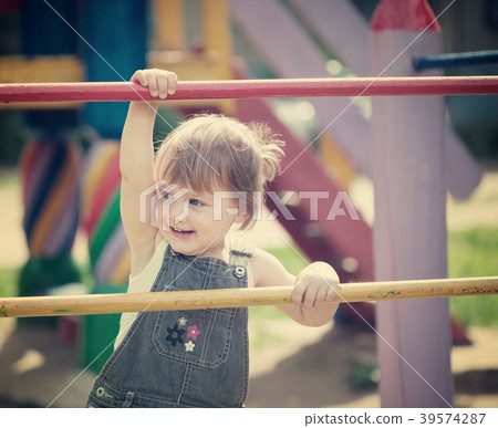 Portrait of two-year child at playground Portrait of two-year child at playground 39574287