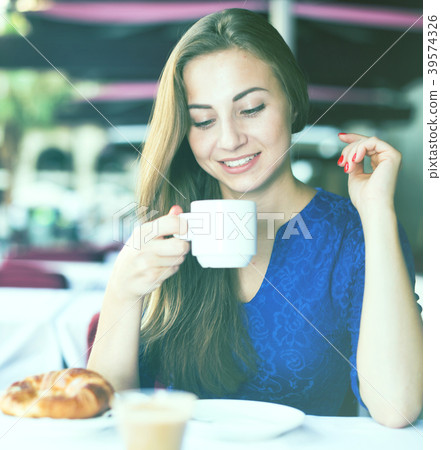 Portrait of elegant female who is enjoying of lunch with coffee Portrait of elegant female who is enjoying of lunch with coffee 39574326
