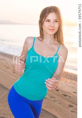 Sportswoman is jogging Sportswoman is jogging 39574751