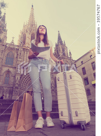 young woman having map and looking for her route in the city young woman having map and looking for her route in the city 39574767