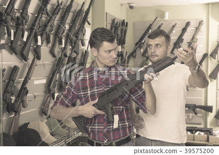 Men choosing air weapon Men choosing air weapon 39575200