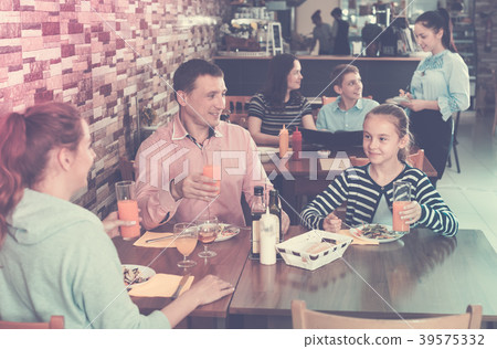 Family dining and talking 39575332