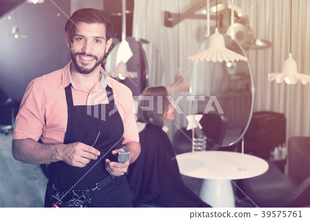 smiling man hairdresser and woman in salon 39575761