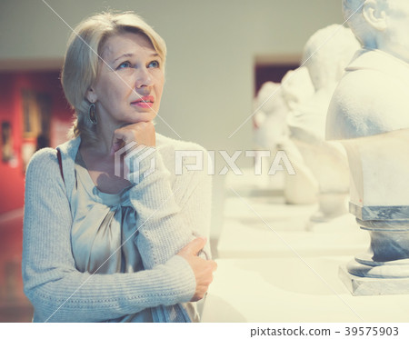 Portrait of woman visitor near sculpture Portrait of woman visitor near sculpture 39575903