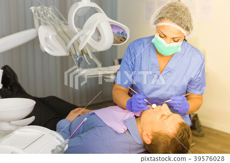 dentist professional filling teeth for man dentist professional filling teeth for man 39576028