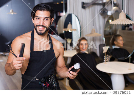 professional male hairdresser with visitor professional male hairdresser with visitor 39576031