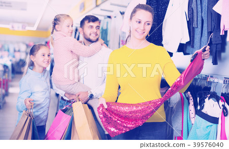 woman looking new red dress woman looking new red dress 39576040