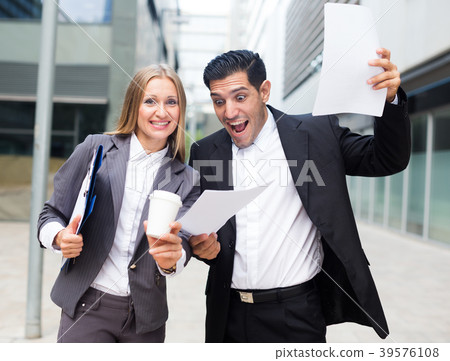 Businessman and his boss woman are signed successful contract Businessman and his boss woman are signed successful contract 39576108