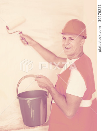 house painters with paint roller 39576231