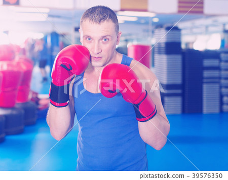 Portrait of young male who is boxing Portrait of young male who is boxing 39576350