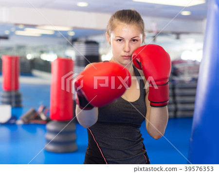 Portrait of woman who is training in box gym. Portrait of woman who is training in box gym. 39576353