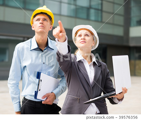 Couple architectors are estimating results of their project Couple architectors are estimating results of their project 39576356