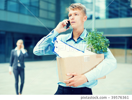 Office worker is talking phone about the new job Office worker is talking phone about the new job 39576361