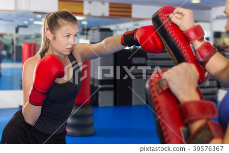 Woman boxer is training Woman boxer is training 39576367