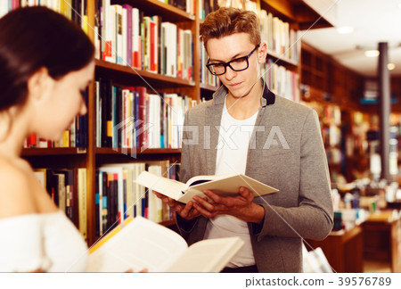 Student browsing textbooks in library Student browsing textbooks in library 39576789