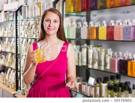 Female choosing sweet liquid soap 39576905