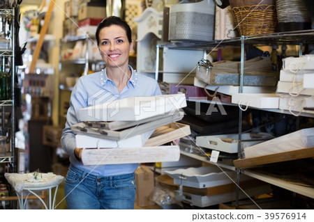 Beautiful woman holding wooden boxes for her apartment 39576914
