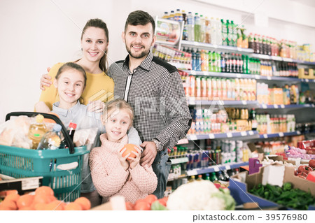 family shoppers in vegetable department family shoppers in vegetable department 39576980
