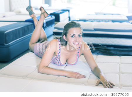 girl in a dress is lying on a mattress girl in a dress is lying on a mattress 39577005