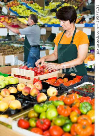 Smiling female seller in the supermarket Smiling female seller in the supermarket 39577153