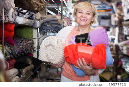 elderly female purchaser holding soft plaids elderly female purchaser holding soft plaids 39577713