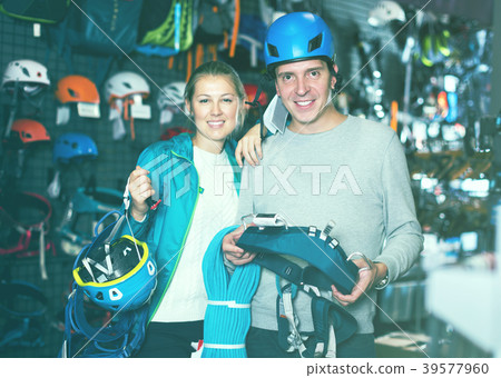 Athletes chooses climbing equipment 39577960
