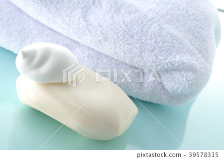 Towel and soap and foam 39578315