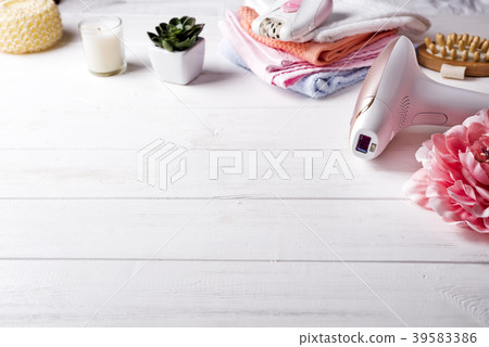 Modern laser epilator with bath accessories on 39583386