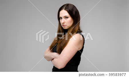 Attractive young serious angry brunette caucasian 39583977