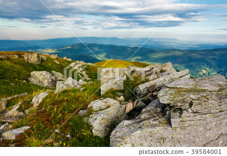 huge rocky formations on the grassy hills 39584001