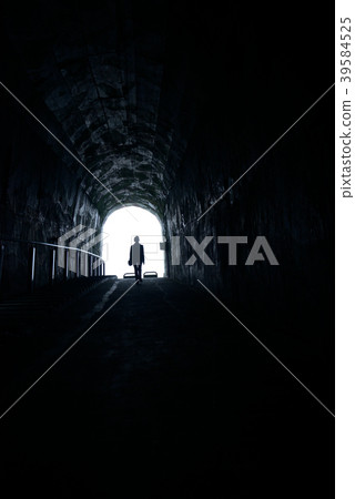 The man walked toward the light of the hole 39584525