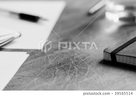 View of the workplace. Open notebook over table. View of the workplace. Open notebook over table. 39585514