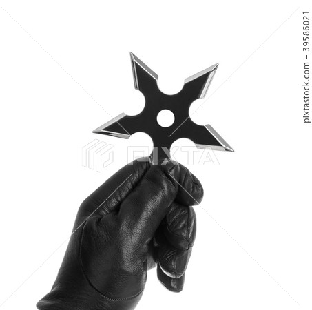 Hand is throwing ninja shuriken Hand is throwing ninja shuriken 39586021