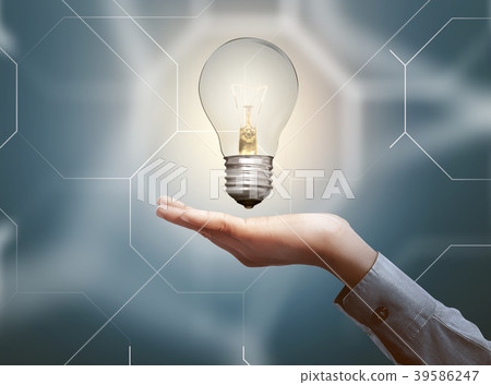 Human hands holding light bulb  39586247