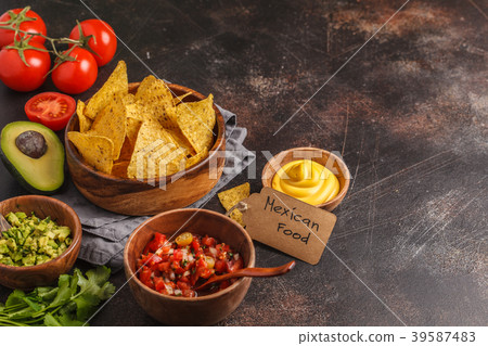 Mexican food concept. Nachos - yellow corn totopos Mexican food concept. Nachos - yellow corn totopos 39587483