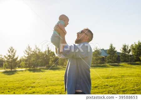 Father and child playing on field nature Father and child playing on field nature 39588653
